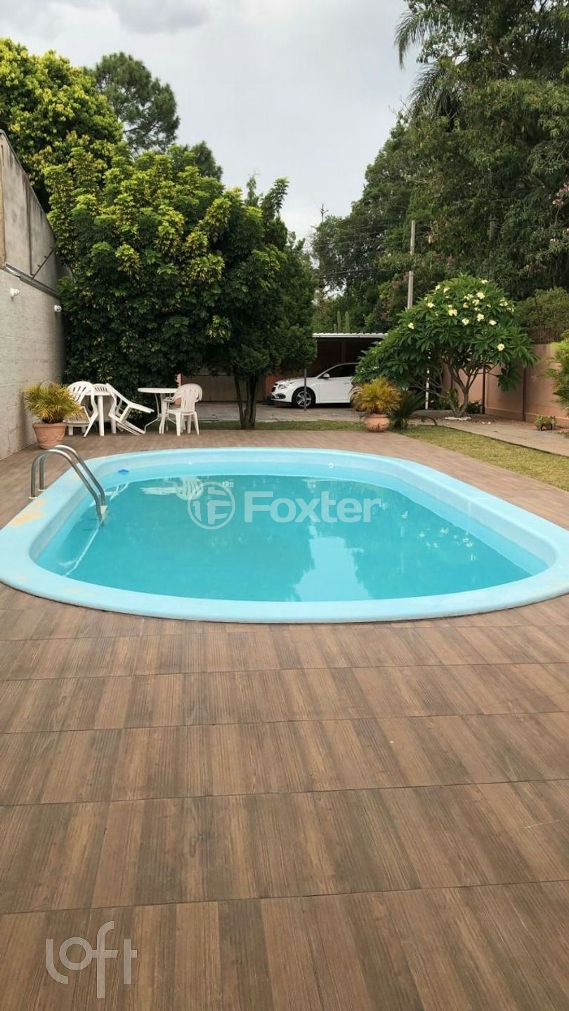 Casa à venda com 3 quartos, 106m² - Foto 1